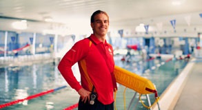 Council employee standing in front of a council pool