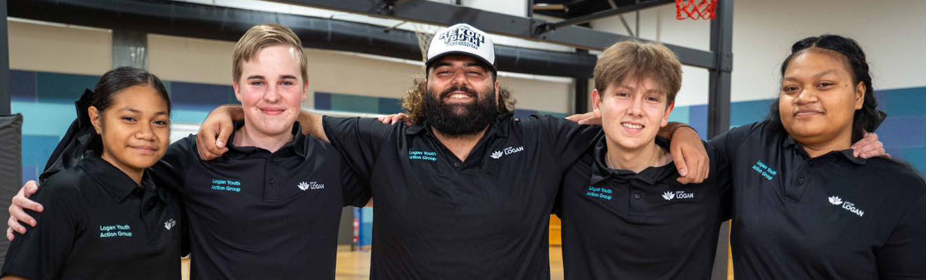 logan youth action group smiling and standing side by side