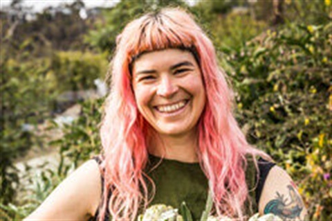 Hanna Moloney standing in front of green trees