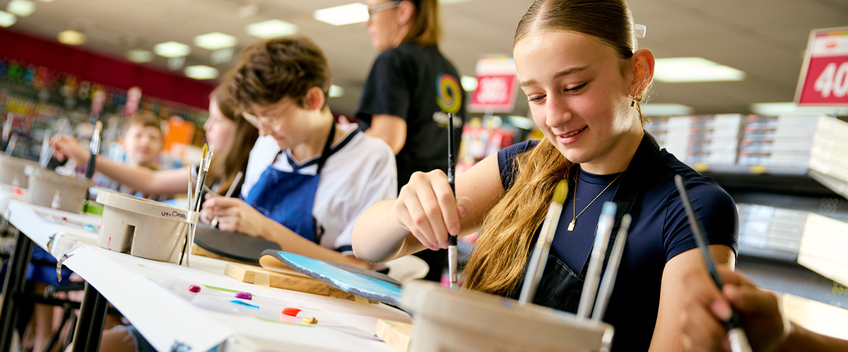Girl painting at art workshop