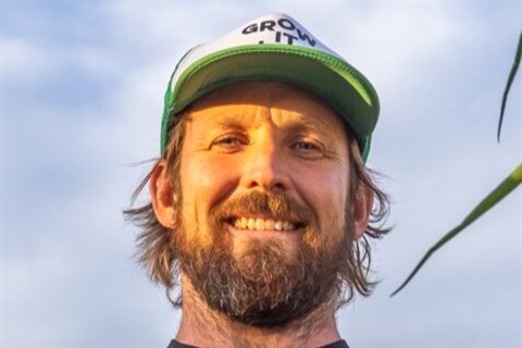 Paul West with a cloudy sky in the background