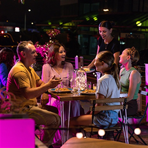A family dining outside at a restaurant