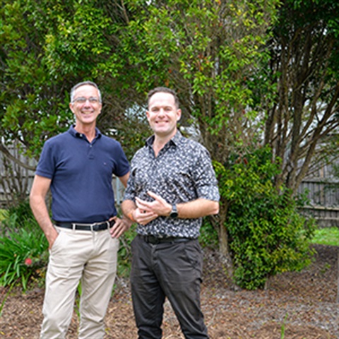 Mayor Jon Raven and Councillor Paul Jackson in front of a new buffer ganden planted to protect the Gossia gonoclada trees