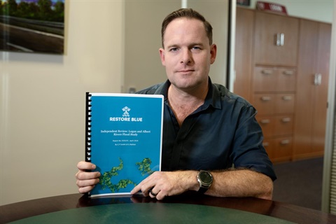 Mayor Jon Raven with the independent review report
