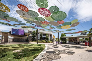 Decorative circles form undercover area in the outdoor space