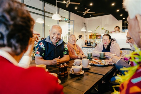 Group having coffee together around a table