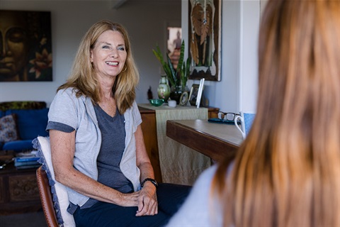 mother and daughter having coffee