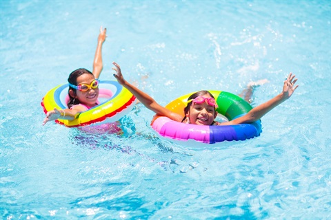 Children enjoying a public pool