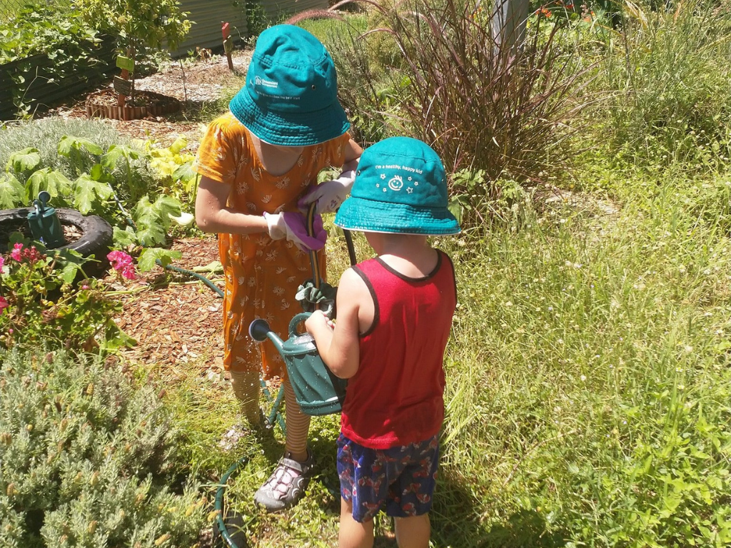 Children helping out at Kingston East Neighbourhood Centre Community Garden