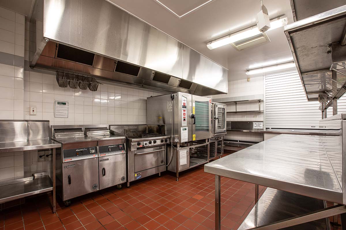 Commercial kitchen with stainless steel benchtops and appliances