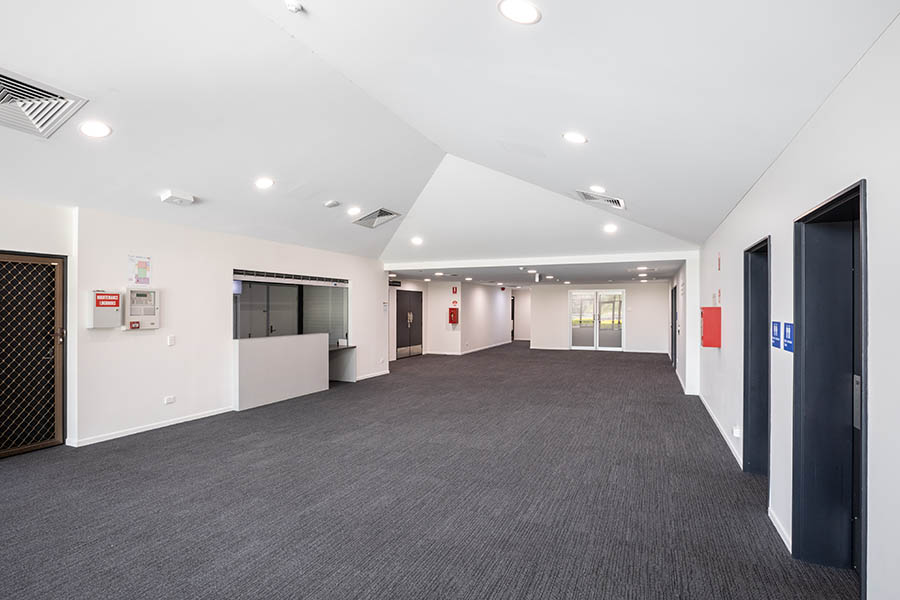 Grey carpeted foyer area