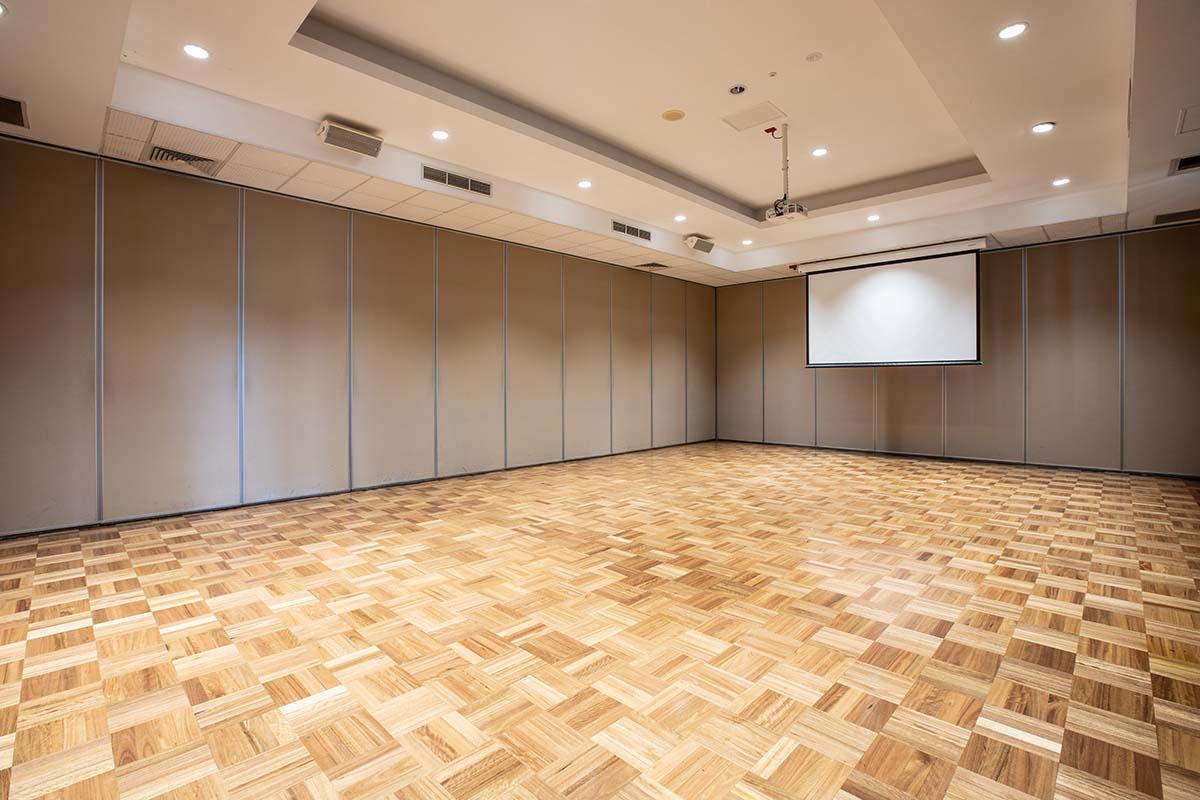 Open room with polished wooden floors