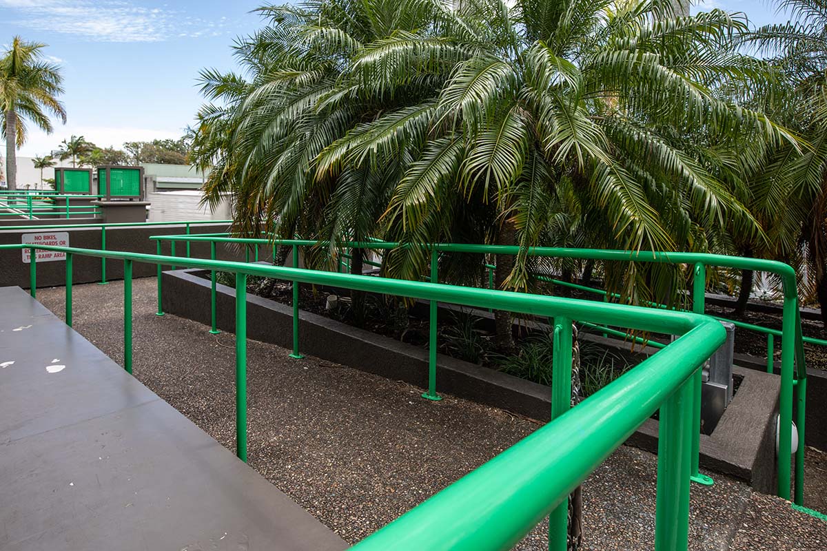 Outdoor ramp with green hand rails