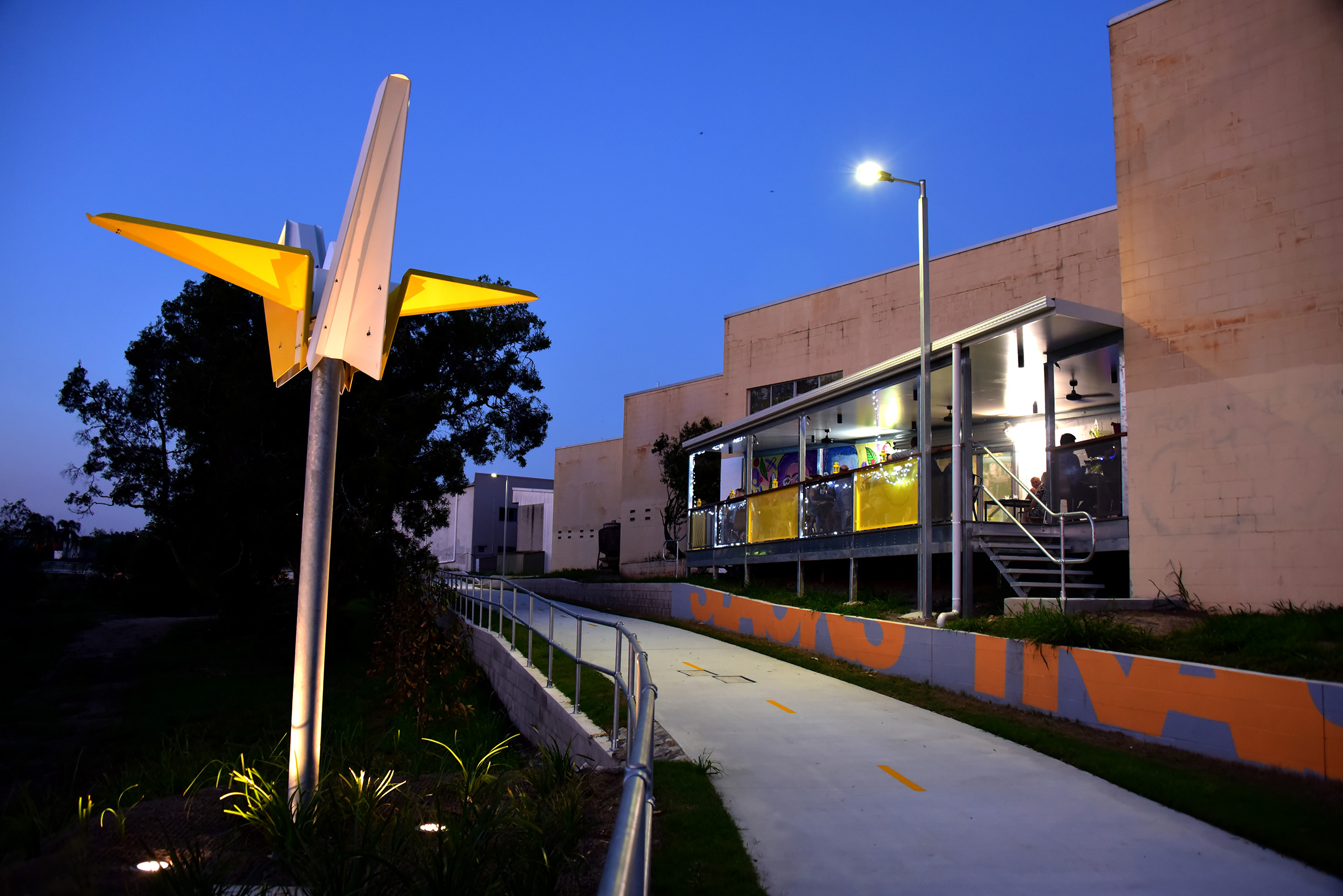 Slacks Creek track activation, orgigami crane statues at night dining precinct