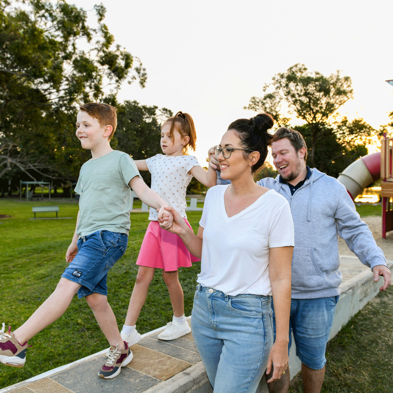 This is a photo of a family in a park