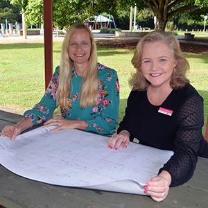 An image of City Lifestyle Chair Cr Laurie Koranski and Division 10 Cr Miriam Stemp reviewing plans for the $6.34 million upgrade of Alexander Clark Park in Loganholme.