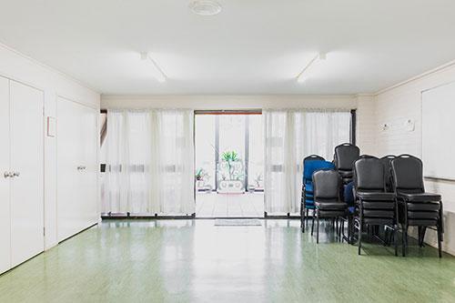 white brick room which opens onto a small courtyard