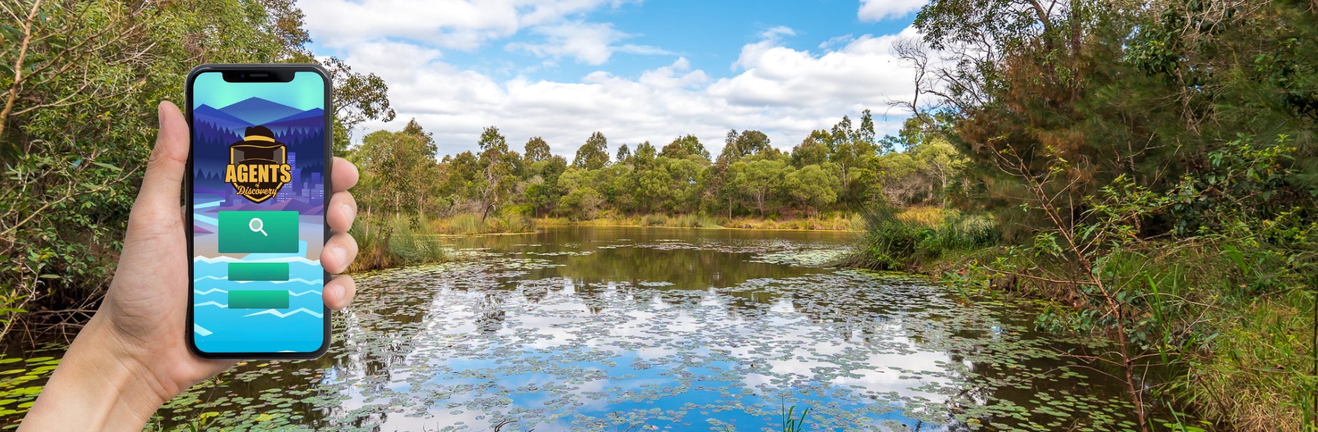 A landscape of Berrinba wetlands, a hand holding an iphone that is open to the Agents of Discovery App