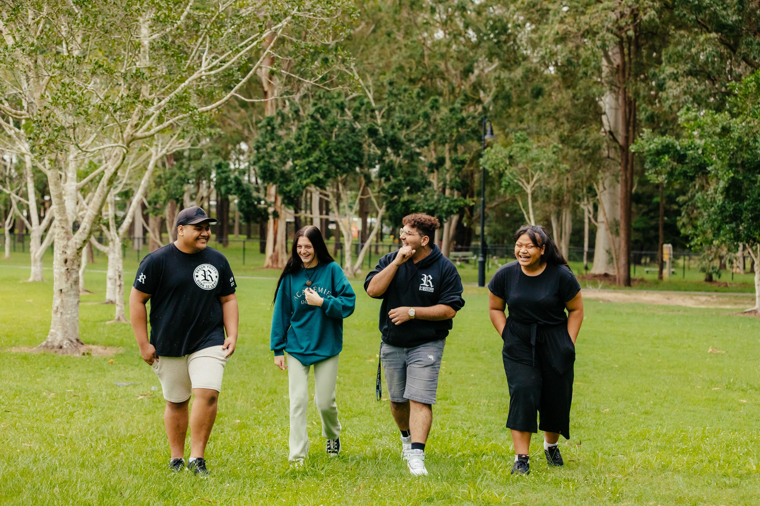 A group of people standing in a park