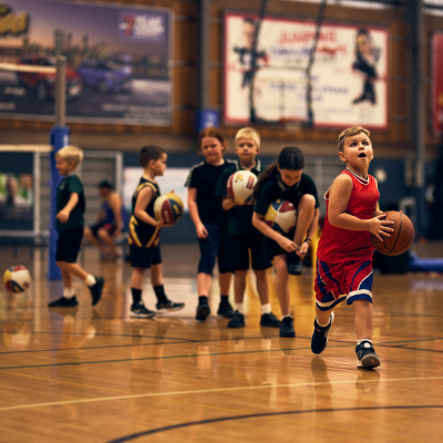 A line up of young children holding basketmalls