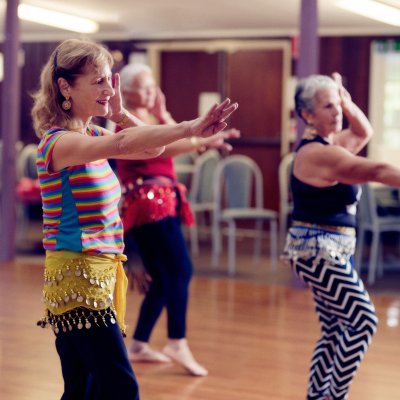 A group of women bellydancing