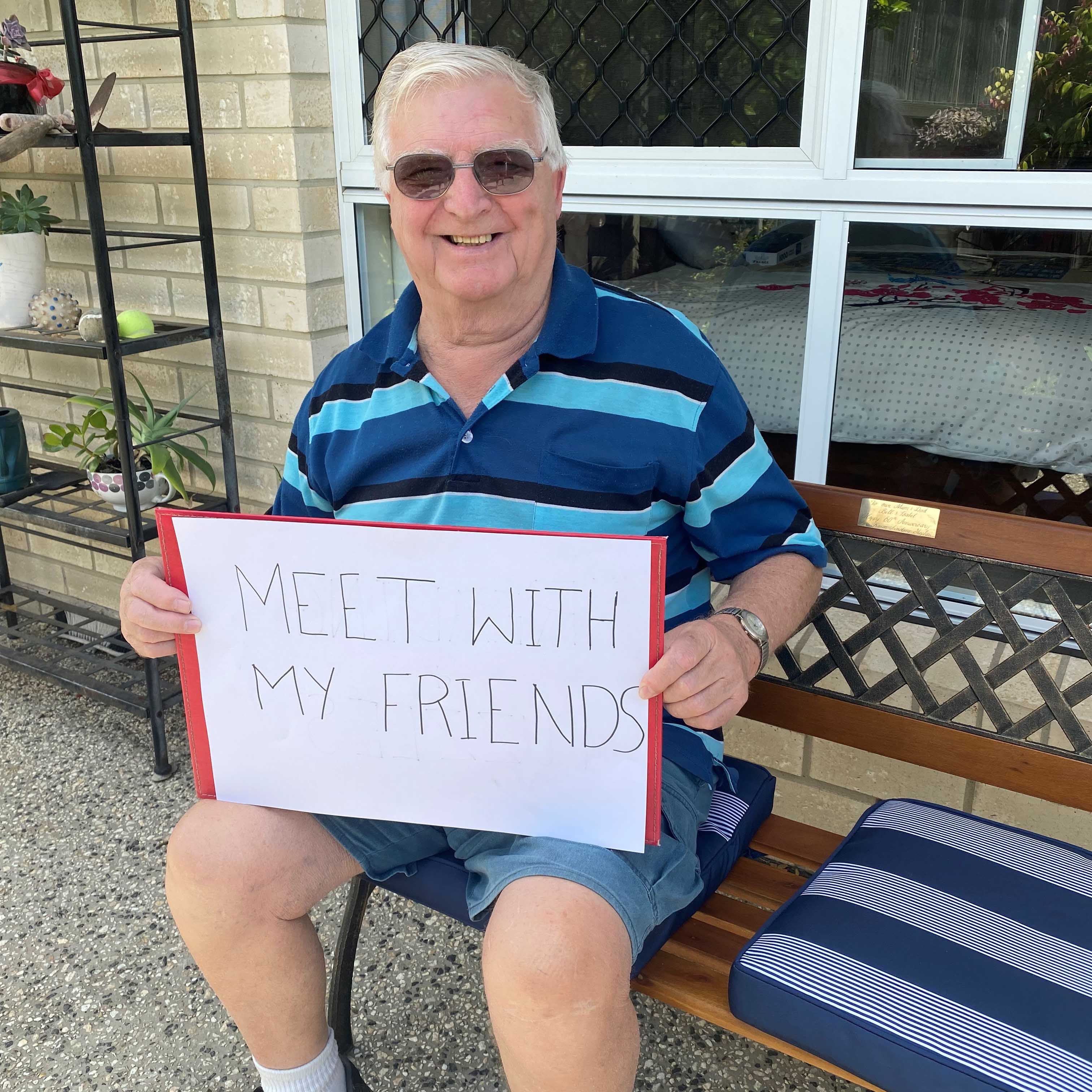 This is a picture of a man holding a sign.