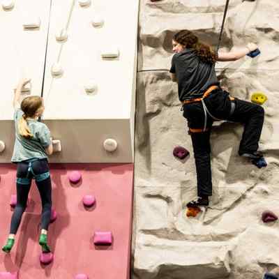 Two kids rock climbing