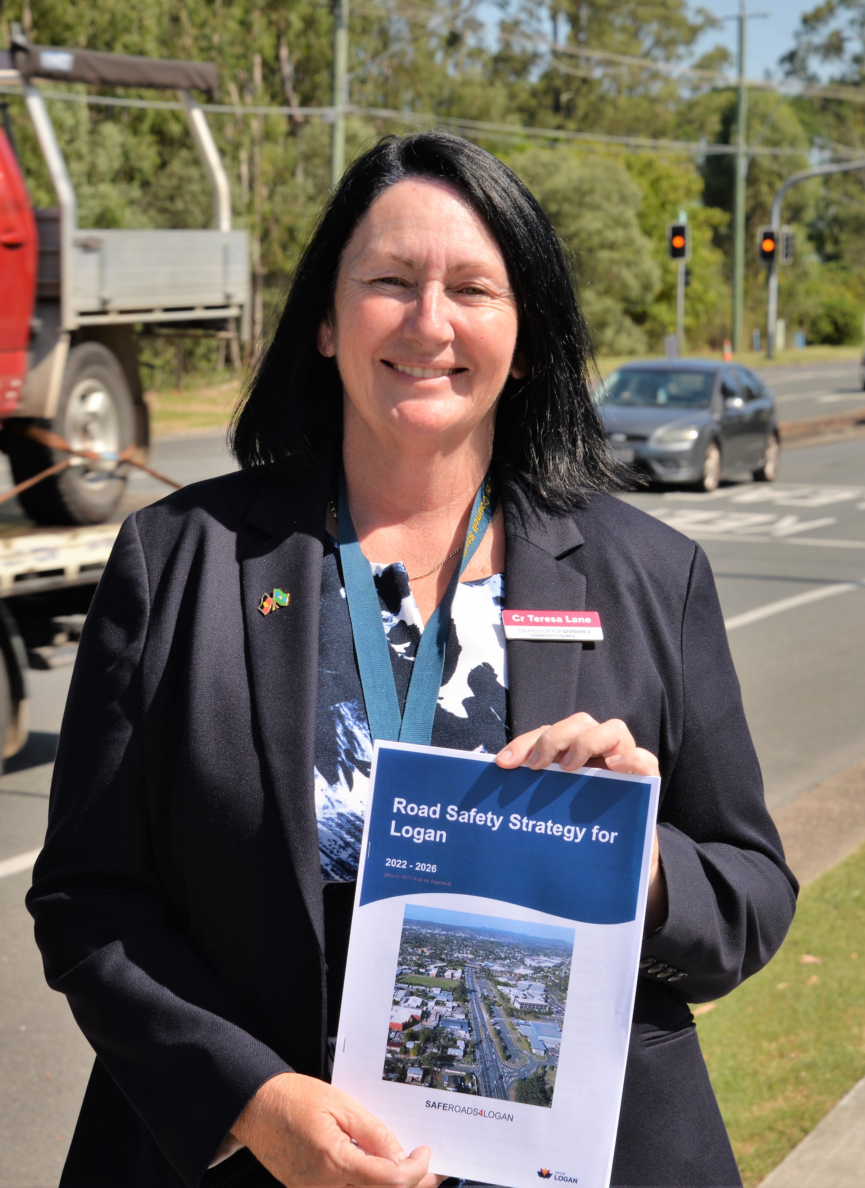 Logan City Council Infrastructure Chair Councillor Teresa Lane with the SafeRoads4Logan Road Safety Strategy 2022-26