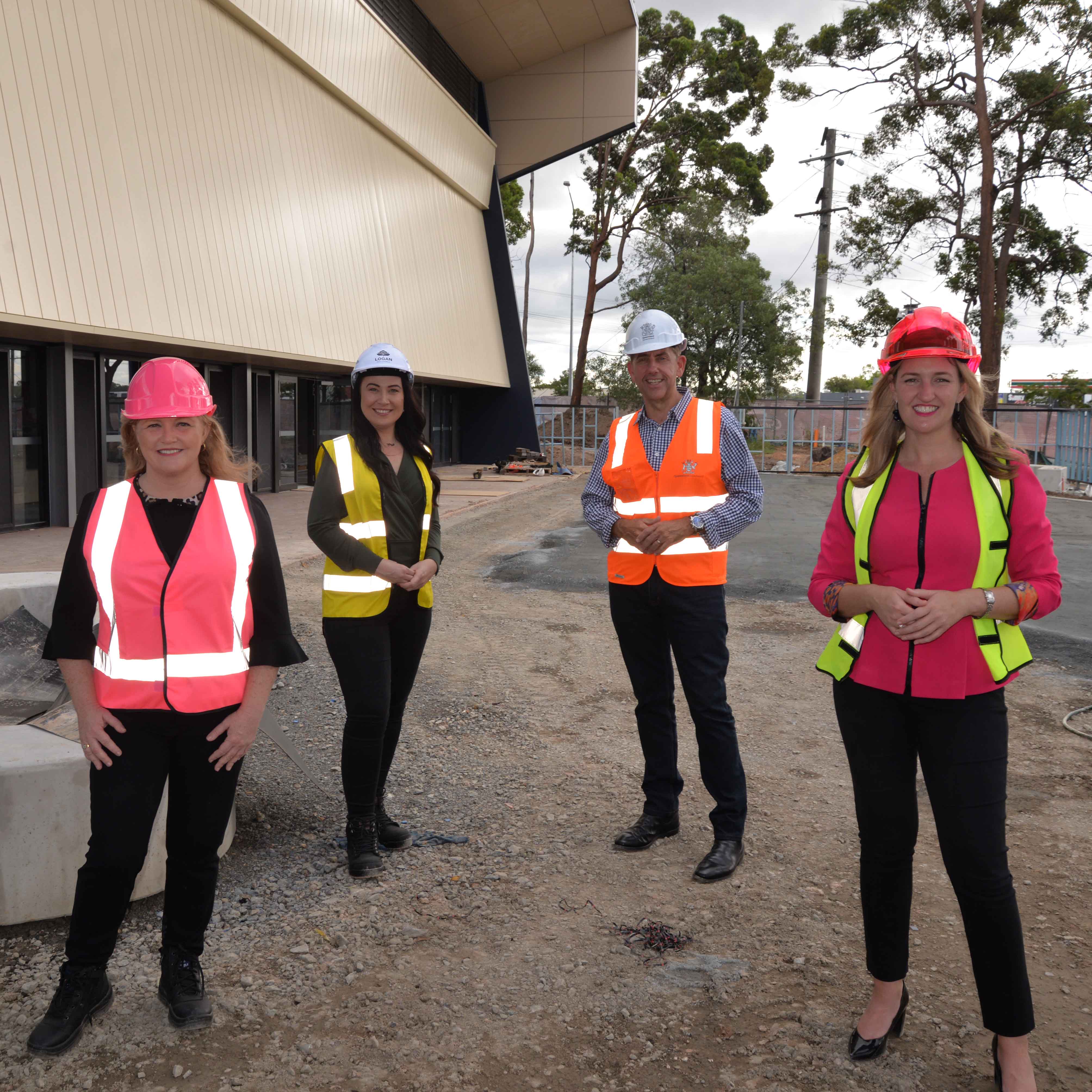 This is an image of four people standing in front of the new PCYC building.