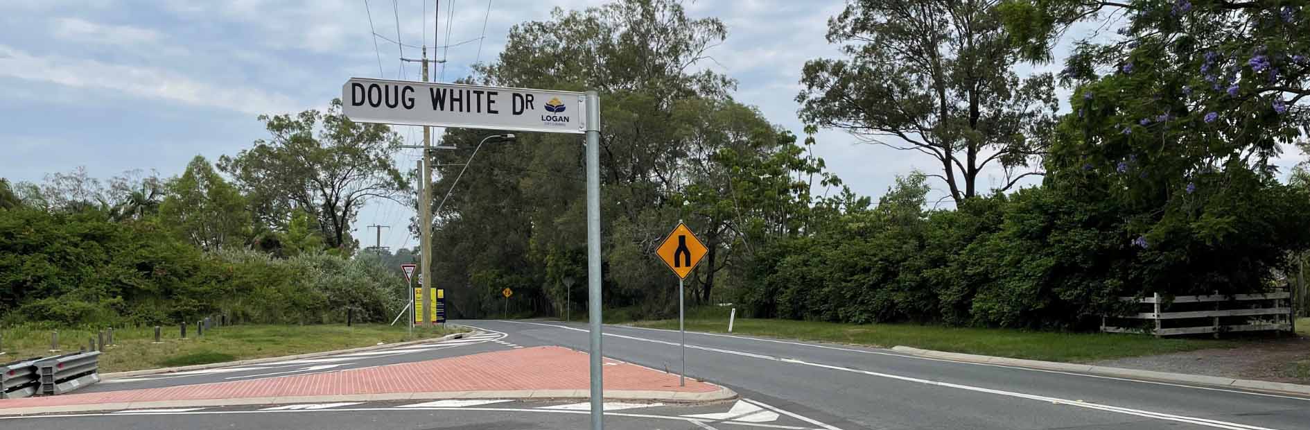 Logan Council branded street sign saying Doug White Drive