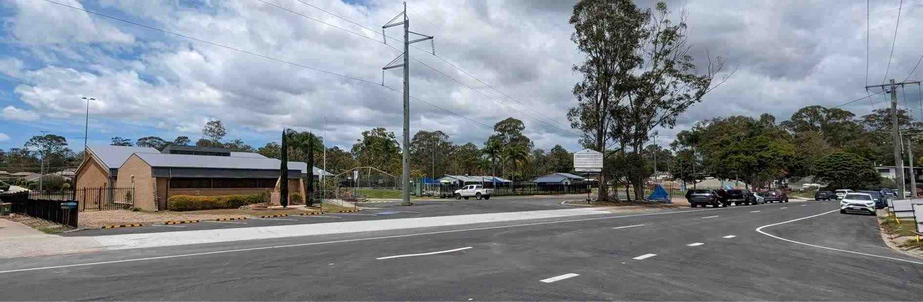 Wide angle view of a road displaying the Eagleby master drainage project