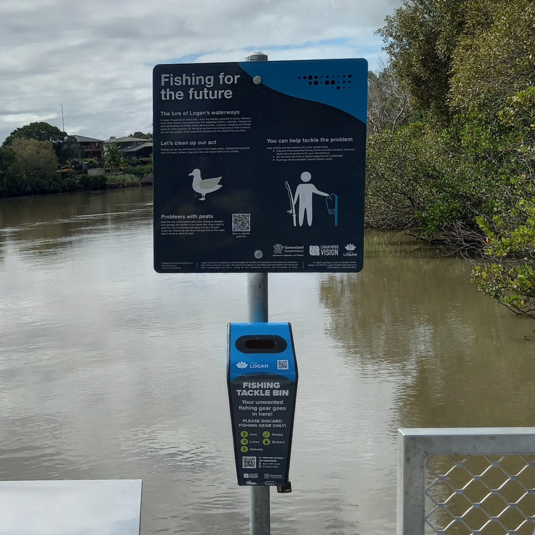 A fishing tacklebox overlooking a river