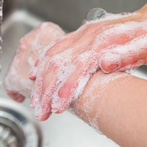 An image of someone thorough washing their hands.
