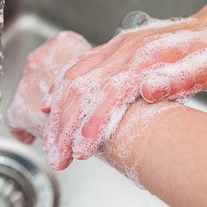 Image of person washing hands