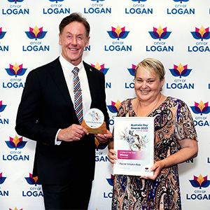 City of Logan Mayor Darren Power presents Rachel Simpkin-Bale with the City of Logan 2023 Citizen of the Year.