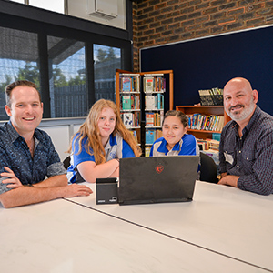 Councillor Jon Raven, Woodridge State High School students Elliot, 14, Jenielyn Ocampo, 13, and Kingdom Community Life Care co-founder Robert Jurlina.