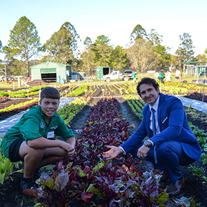 Division 6 Councillor Tony Hall with student Isaac at the launch of The Mini Farm Project at Loganlea State High School.