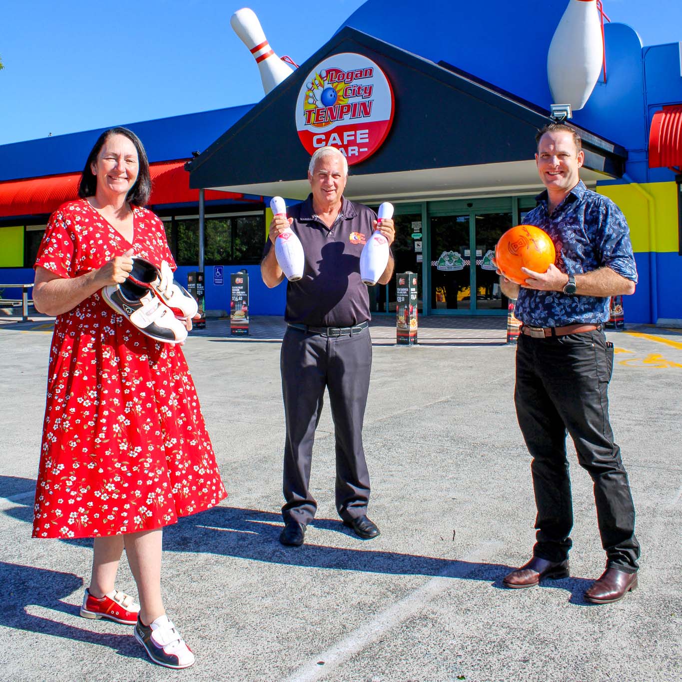 Economic Development Chair Jon Raven (right), Division 2 Councillor Teresa Lane and Logan City Tenpin's Bruce Morris in front of the alley's fresh new entrance, co-funded through Logan City Council's Façade Improvement Program.