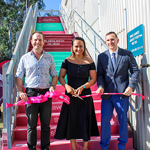 Cr Jon Raven and Cr Tony Hall (right) open the new ‘Hope Stairs’ in Meadowbrook with The Solitude Project founder Destani Davies.