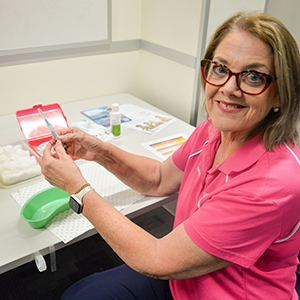 Immunisation nurse Judy McCullough prepares a vaccination.