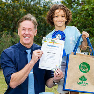 Mayor Darren Power with Mayor’s Choice winner Zachary Jacobs, from St Edward’s Catholic Primary School at Daisy Hill, at the Logan Eco Action Festival (LEAF) on Sunday.
