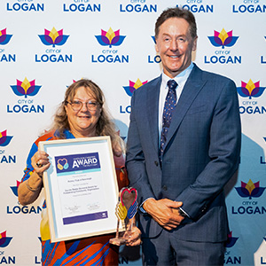 Mayor Darren Power presents former President of the Rotary Club of Beenleigh, Heather Kucks with the 2022 Davida Steele Memorial Award at the 2022 Logan Volunteer Thank You Breakfast.