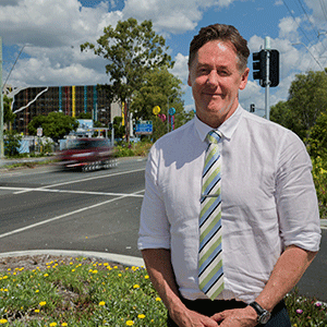 Mayor Darren Power stands next to Loganlea Road.