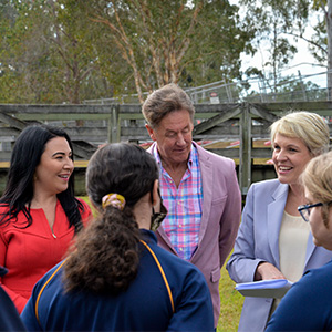 (From left) Cr Mindy Russell, Mayor Darren Power and Federal Minister for the Environment and Water Tanya Plibersek MP chat with Mabel Park High School students at Slacks Creek in Mabel Park.