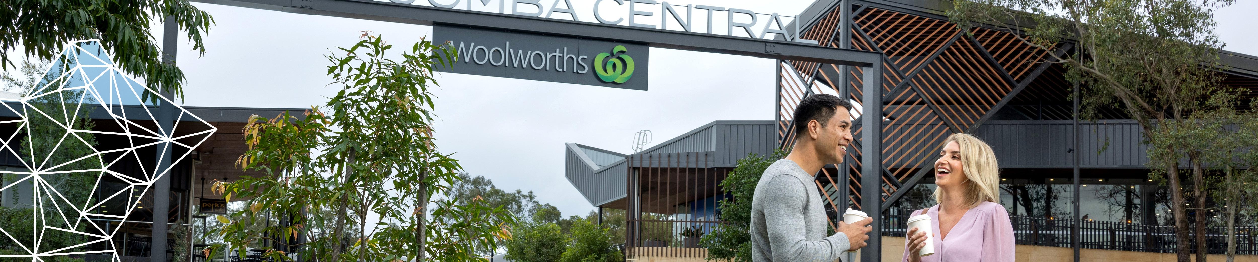 Couple enjoy coffee in front of Jimboomba Central, overall winner of the 2020 Logan Urban Design Awards