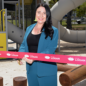 An image of Councillor Mindy Russell cutting a ribbon to open the $1.8 million upgrade of Mabel Park in Slacks Creek.