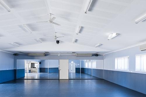 Blue room with mirrored wall at the end