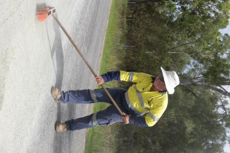 Man sweeping road