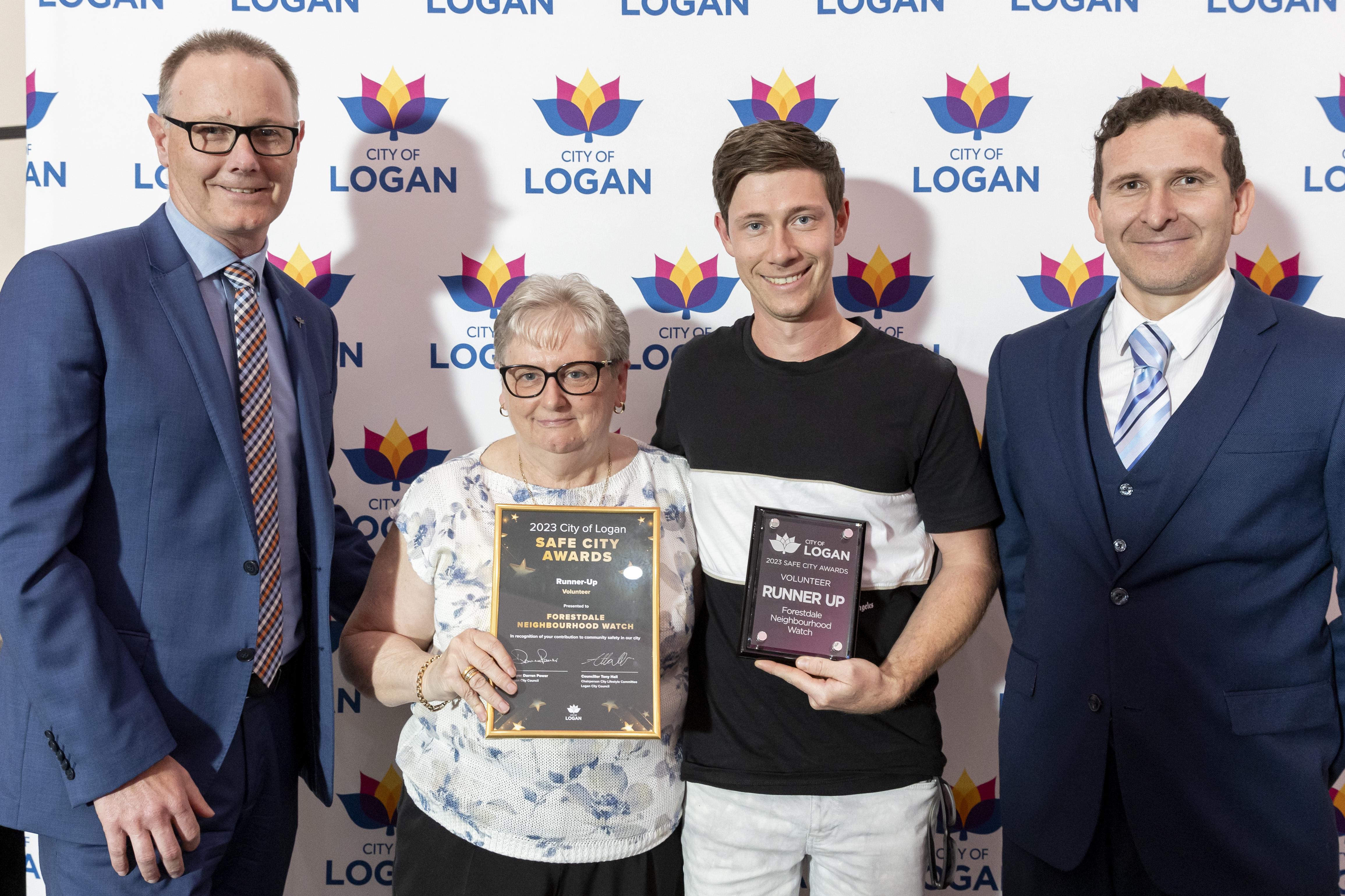 Volunteer category runner-up Lynn Whittingham and Clay Yates from Forestdale Neighbourhood Watch with Brad White and Cr Tony Hall at City of Logan Safe City Awards