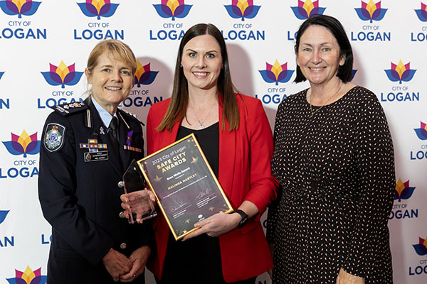 Yarrabilba community champion Melinda Hartley is awarded the Stan Wells Award by Logan District Chief Superintendent Mel Adams (left) and Division 2 Councillor Teresa Lane at the 2023 City of Logan Safe City Awards for the work she has done locally.